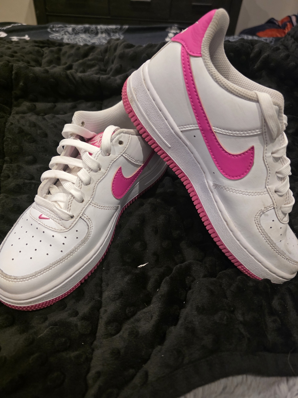 Nike Air Force 1 White Low-Top with Bright Pink Swoosh and Outsole.